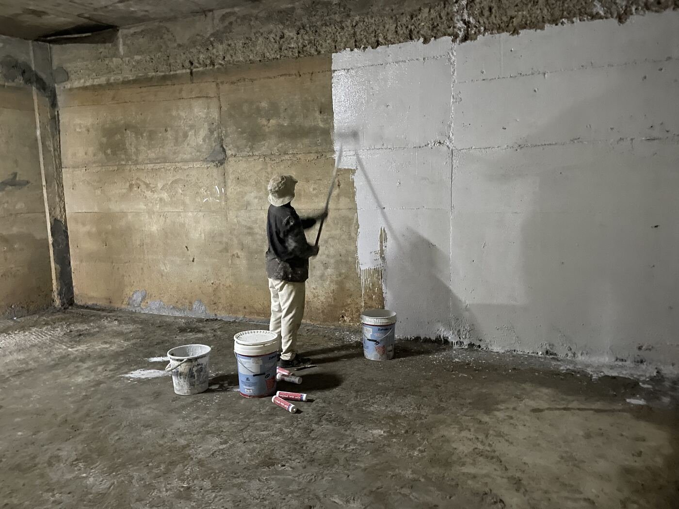Applying basement wall waterproof coating on site