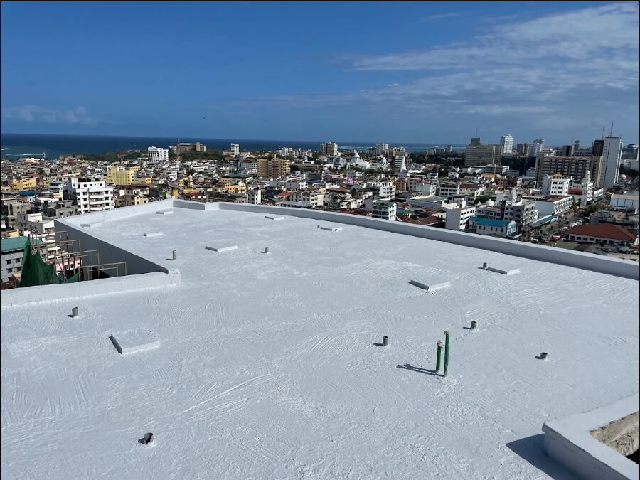 Flat roof after waterproofing, fully coated white