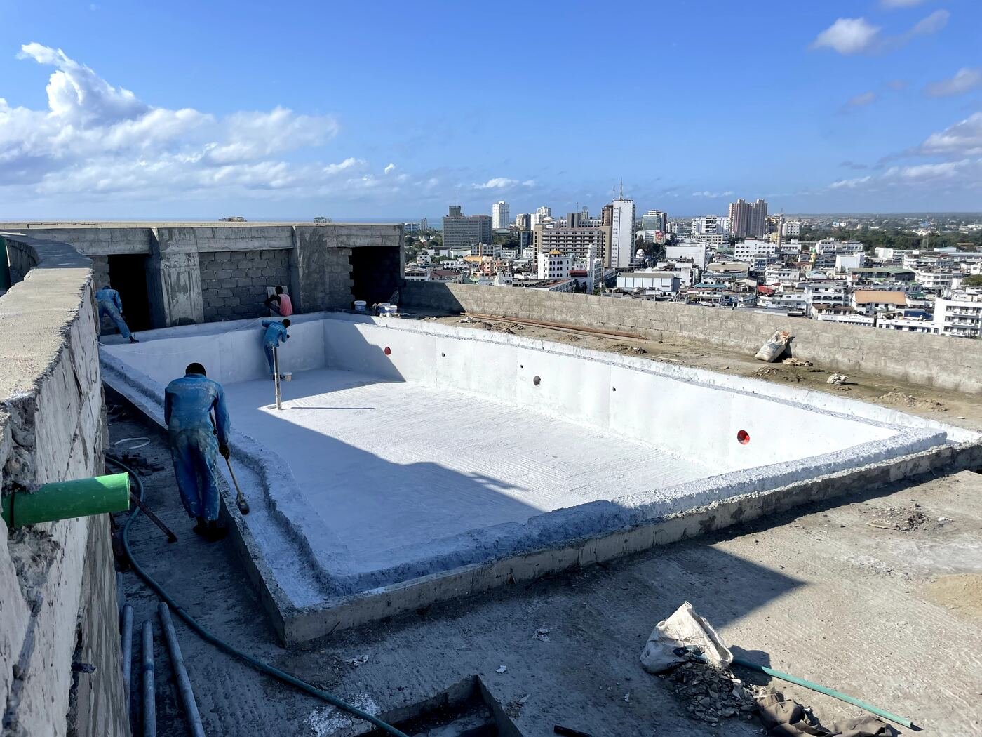 Swimming pool waterproofing, coastal city skyline