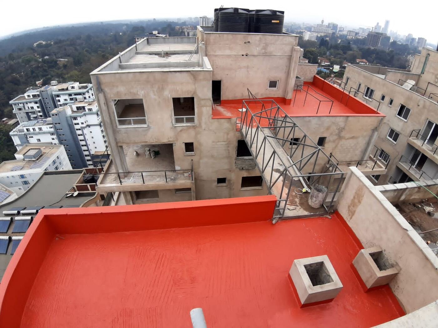 Multi-unit rooftop slab waterproofing, apartment complex